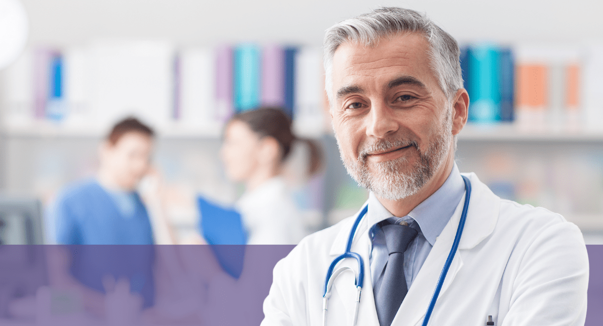 confident smiling physician looking at camera